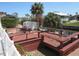 Relaxing waterfront retreat featuring a spacious wooden deck and access to beautiful canal views at 1027 Newton St, Englewood, FL 34224