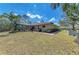 Expansive backyard featuring a screened-in pool and plenty of space for outdoor enjoyment at 1127 133Rd E St, Bradenton, FL 34212