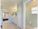 Bathroom with tiled floor and vanity, featuring an adjacent toilet and closet area at 1127 133Rd E St, Bradenton, FL 34212