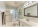 Bathroom with white vanity, sink, toilet, tub, and leafy patterned shower curtain at 1127 133Rd E St, Bradenton, FL 34212