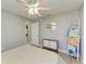 Bedroom features a ceiling fan, closet, dresser, and window with a view at 1127 133Rd E St, Bradenton, FL 34212