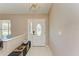 Bright entryway featuring neutral walls, tile floors, and decorative bench with a window at 1127 133Rd E St, Bradenton, FL 34212