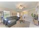 Comfortable living room with a leather sectional sofa, large window, and neutral décor at 1127 133Rd E St, Bradenton, FL 34212