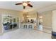 Spacious living area with an open floor plan, seamlessly connecting the kitchen, living room, and lanai at 1127 133Rd E St, Bradenton, FL 34212