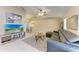 Spacious living room with tile flooring, a vaulted ceiling, and a comfortable leather sofa at 1127 133Rd E St, Bradenton, FL 34212