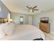 Spacious main bedroom featuring a ceiling fan, stylish decor, and a comfortable king-size bed at 1127 133Rd E St, Bradenton, FL 34212