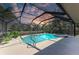 Screened-in pool and spa with a view of the water and private backyard at 1127 133Rd E St, Bradenton, FL 34212