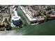 Stunning aerial view of a waterfront community with boat docks and lush landscaping at 1250 N Portofino Dr # 201, Sarasota, FL 34242