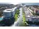 Stunning aerial view of waterfront condos with boat docks and lush landscaping near the beautiful ocean at 1250 N Portofino Dr # 201, Sarasota, FL 34242