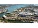A panoramic aerial view of waterfront property with condos, boat docks, a marina, and bridge access at 1250 N Portofino Dr # 201, Sarasota, FL 34242