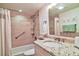 Cozy bathroom with tub, shower, and sink at 1250 N Portofino Dr # 201, Sarasota, FL 34242