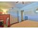 Bedroom with ceiling fan, wood floors, a closet, and views to other areas of the home at 1250 N Portofino Dr # 201, Sarasota, FL 34242