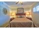 Comfortable bedroom with a ceiling fan and natural light at 1250 N Portofino Dr # 201, Sarasota, FL 34242