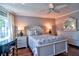 Serene bedroom with hardwood floors and a ceiling fan at 1250 N Portofino Dr # 201, Sarasota, FL 34242