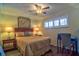 Comfortable bedroom featuring a ceiling fan and natural light at 1250 N Portofino Dr # 201, Sarasota, FL 34242