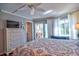 Comfortable bedroom featuring hardwood floors, neutral colors, and private balcony access at 1250 N Portofino Dr # 201, Sarasota, FL 34242