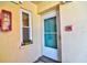 Inviting front door with a window, enhancing the curb appeal at 1250 N Portofino Dr # 201, Sarasota, FL 34242