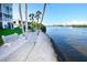Relax by the water on these benches next to the walkway in the waterfront community at 1250 N Portofino Dr # 201, Sarasota, FL 34242