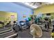 Community gym equipped with treadmills, elliptical machines, weights, and mirrored walls at 1250 N Portofino Dr # 201, Sarasota, FL 34242