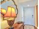Entryway featuring a decorative table and lamp with wood floors at 1250 N Portofino Dr # 201, Sarasota, FL 34242