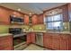Well-equipped kitchen with stainless steel appliances and ample cabinet space at 1250 N Portofino Dr # 201, Sarasota, FL 34242