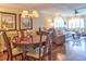 Open-concept living and dining area with hardwood floors and ample natural light at 1250 N Portofino Dr # 201, Sarasota, FL 34242