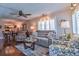 Comfortable living room boasts a plush sofa, hardwood floors, and stylish decor at 1250 N Portofino Dr # 201, Sarasota, FL 34242
