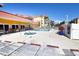 Relaxing pool area with lounge chairs and a jacuzzi, surrounded by well-maintained condos at 1250 N Portofino Dr # 201, Sarasota, FL 34242