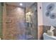Tiled shower with frameless glass door at 1250 N Portofino Dr # 201, Sarasota, FL 34242