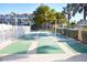 Enjoy a game of shuffleboard on well-maintained courts, part of the community's amenities at 1250 N Portofino Dr # 201, Sarasota, FL 34242