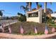 Entrance to Siesta Harbor adorned with American flags and lush greenery, a welcoming sight at 1250 N Portofino Dr # 201, Sarasota, FL 34242