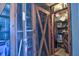 Secured storage area with metal mesh doors and shelving for personal items at 1250 N Portofino Dr # 201, Sarasota, FL 34242