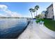 Scenic waterfront views with dock, seating, and walkway perfect for relaxation at 1250 N Portofino Dr # 201, Sarasota, FL 34242