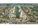 Aerial view featuring condos and canal, complete with waterfront community amenities at 1250 N Portofino Dr # 303, Sarasota, FL 34242