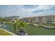 This aerial view shows the canal front condos, boat docks, and the scenic waterfront location at 1250 N Portofino Dr # 303, Sarasota, FL 34242
