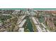 Aerial view of condos, canals, and a nearby beach at 1250 N Portofino Dr # 303, Sarasota, FL 34242