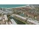 This aerial view showcases a canal-front community near the beach with tennis courts and a pool at 1250 N Portofino Dr # 303, Sarasota, FL 34242