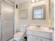 Clean bathroom with glass shower enclosure, white vanity, and modern fixtures at 1250 N Portofino Dr # 303, Sarasota, FL 34242