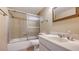 This bathroom features a shower over the tub, vanity and a mirror on the wall at 1250 N Portofino Dr # 303, Sarasota, FL 34242