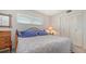 This bedroom features a comfortable bed, ample natural light, and plenty of storage with closet at 1250 N Portofino Dr # 303, Sarasota, FL 34242