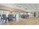 Community dining area featuring tables, chairs, and ample natural light, perfect for gatherings at 1250 N Portofino Dr # 303, Sarasota, FL 34242