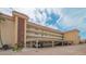 Multi-story condo building exterior with covered parking and views from multiple balconies at 1250 N Portofino Dr # 303, Sarasota, FL 34242