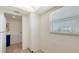 Bright kitchen featuring a large pantry, white cabinets and tile flooring at 1250 N Portofino Dr # 303, Sarasota, FL 34242