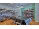 Well-stocked community library room featuring bookshelves and a covered pool table at 1250 N Portofino Dr # 303, Sarasota, FL 34242