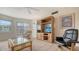 Sunlit living room with updated flooring, sliders to the screened patio, and plush furniture at 1250 N Portofino Dr # 303, Sarasota, FL 34242