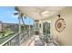 Enjoy outdoor dining on the screened patio, while overlooking the serene waterfront view at 1250 N Portofino Dr # 303, Sarasota, FL 34242