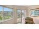 A peek at the beautiful canal views from the inside the sliding glass doors and windows at 1250 N Portofino Dr # 303, Sarasota, FL 34242