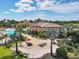 Aerial view of the community pool area showcasing the luxurious amenities and landscaping at 13145 Amerigo Ln, Venice, FL 34293