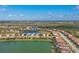 An aerial view of the lake neighborhood showcases the beauty of the community at 13145 Amerigo Ln, Venice, FL 34293