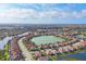 Panoramic aerial of lake community showcasing the beautiful homes and landscape at 13145 Amerigo Ln, Venice, FL 34293